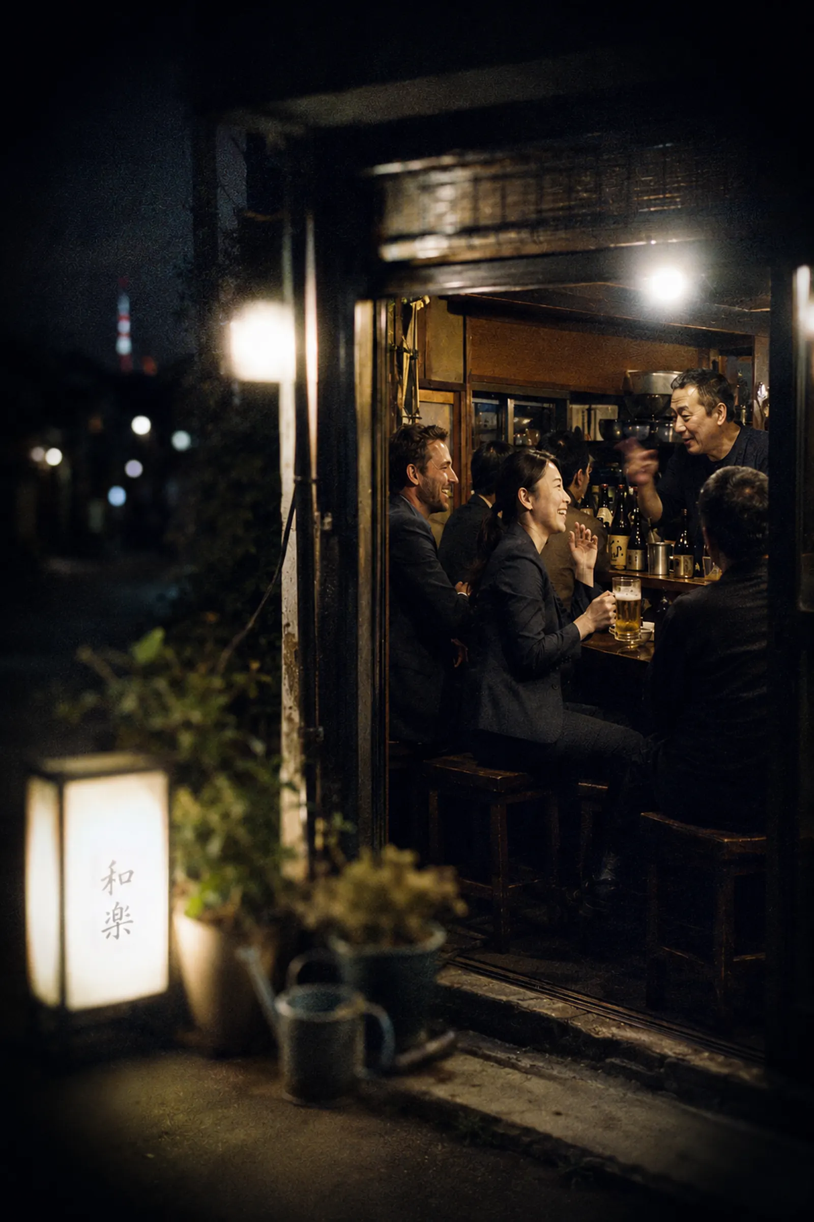 Diners at the counter of a small Japanese izakaya, seen from the street at night